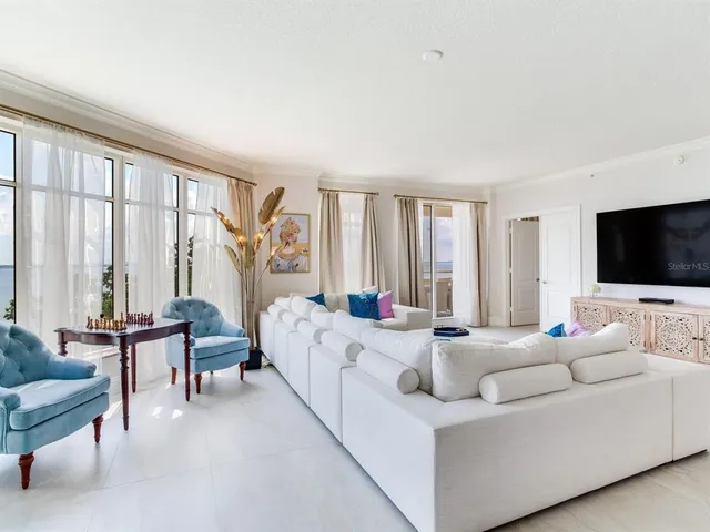 a view of a lake with houses in the back