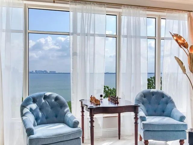 a view of a dining room with furniture window and outside view