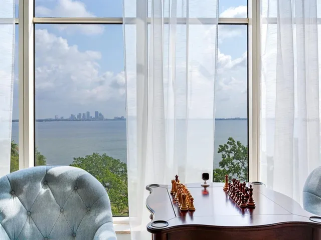 a bathroom with a toilet a sink a vanity and mirror