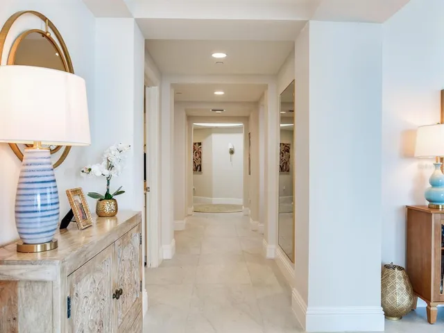a bathroom with a tub a sink and mirror