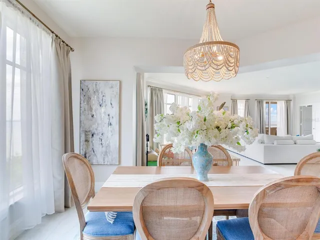 a view of a livingroom with furniture and a flat screen tv