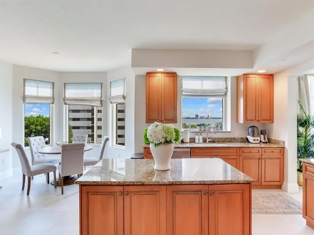 a view of a patio with a table chairs and a potted plants