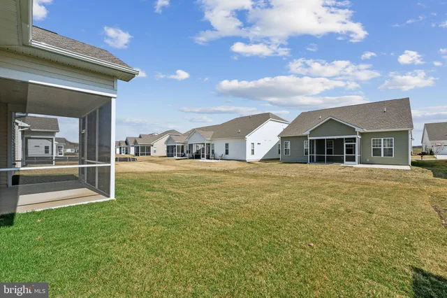 a view of house with yard