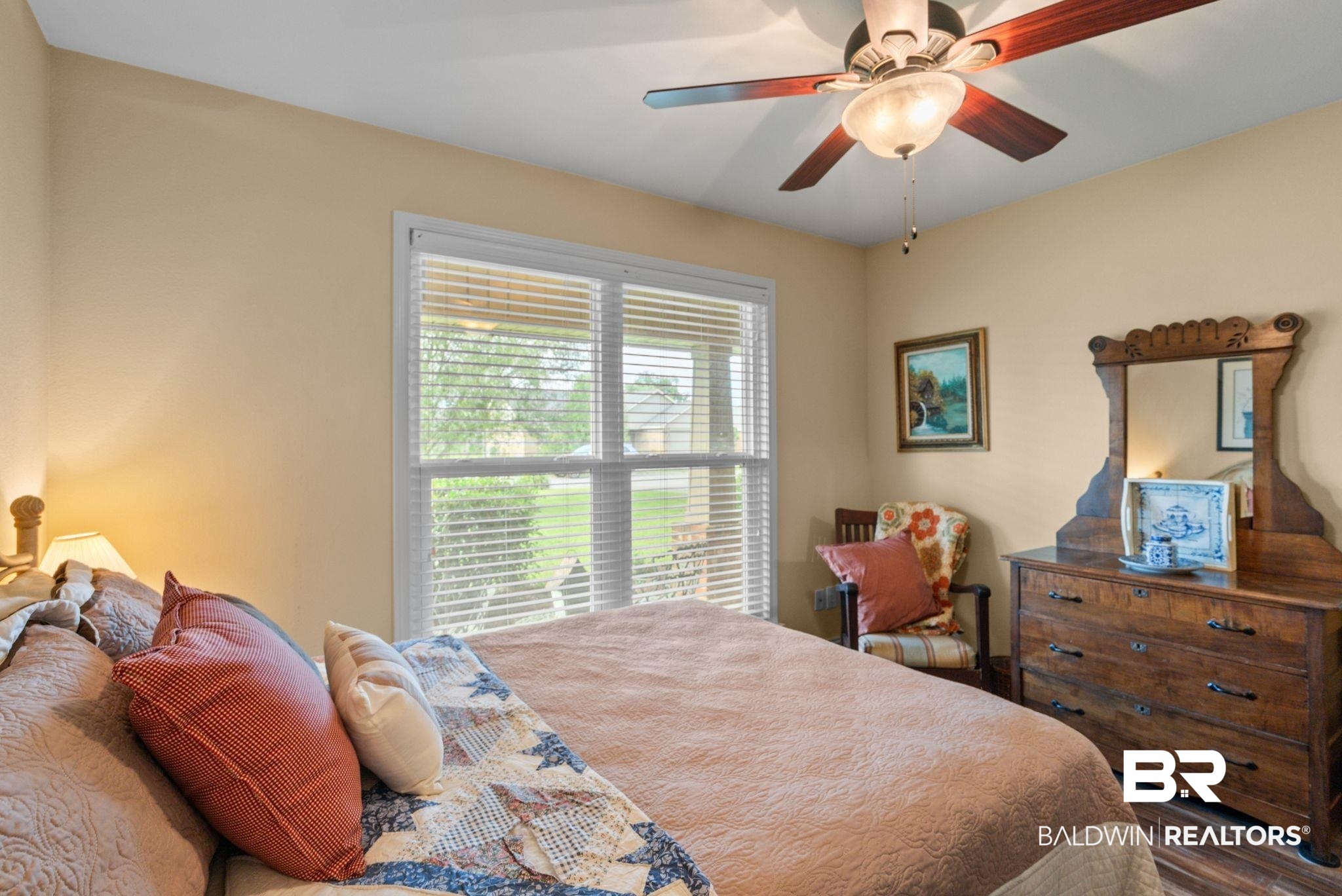 562 Vestige Mews Foley, AL 36535 - Photo 32 of 54 Neutral tone wall paint complements the wood-finish flooring