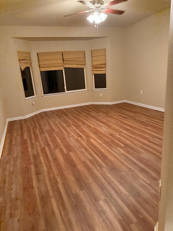 235 Red Poppy Trail Georgetown, TX 78633 - Photo 12 of 21 a view of a livingroom with wooden floor