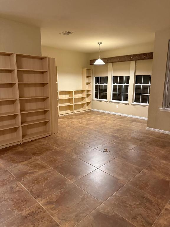 235 Red Poppy Trail Georgetown, TX 78633 - Photo 3 of 21 a view of an empty room with a window