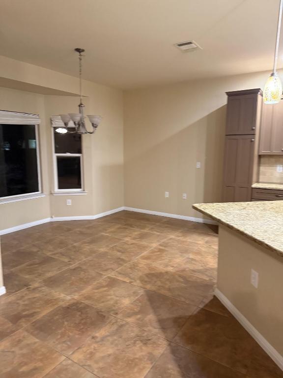 235 Red Poppy Trail Georgetown, TX 78633 - Photo 7 of 21 a view of a kitchen with a sink and a microwave