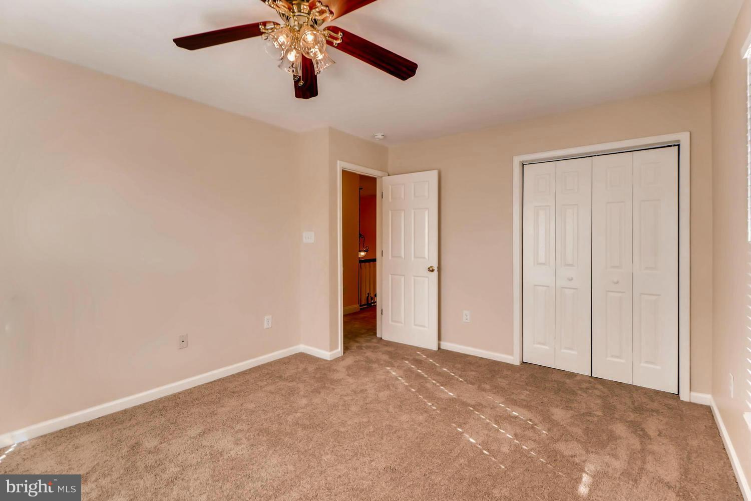 4701 Falls Road Baltimore, MD 21209 - Photo 14 of 28 a view of an empty room and chandelier fan