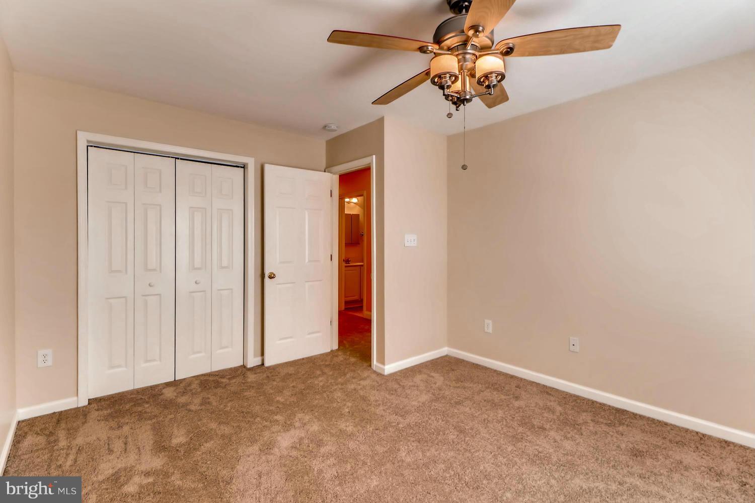 4701 Falls Road Baltimore, MD 21209 - Photo 15 of 28 a view of a room with a ceiling fan and a window