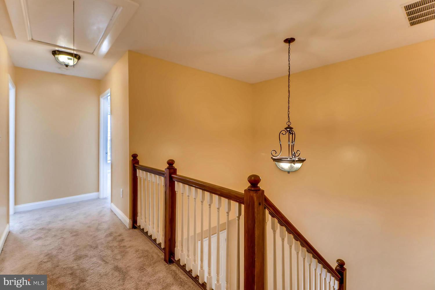 4701 Falls Road Baltimore, MD 21209 - Photo 19 of 28 a view of a hallway with a chandelier