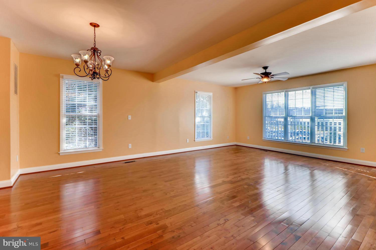 4701 Falls Road Baltimore, MD 21209 - Photo 4 of 28 a view of an empty room with wooden floor and a window