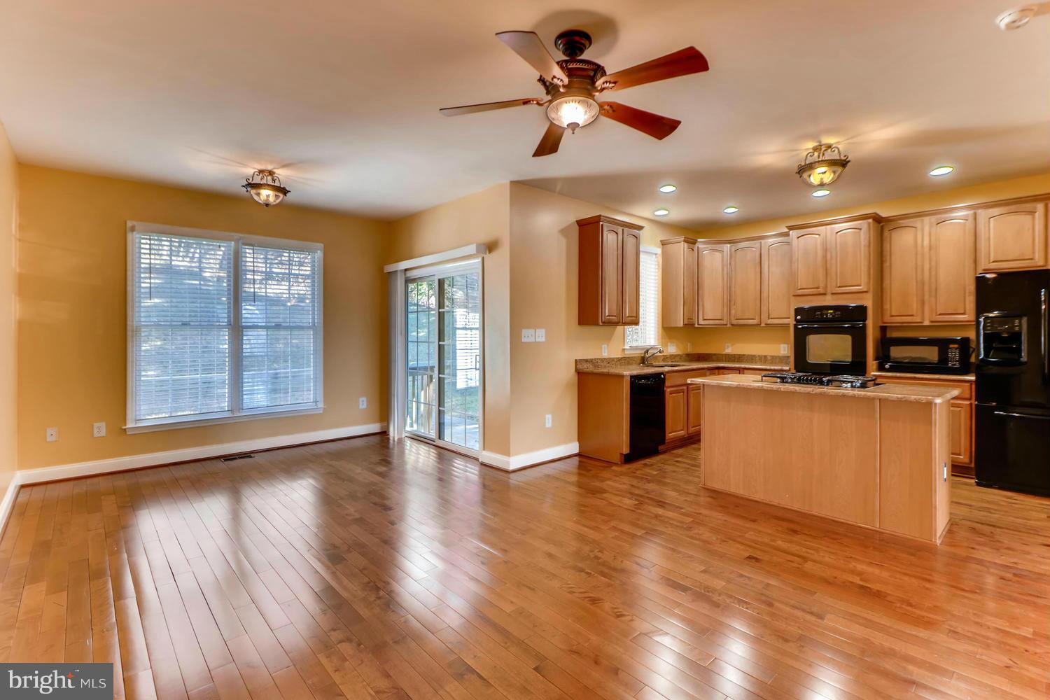 4701 Falls Road Baltimore, MD 21209 - Photo 6 of 28 a view of kitchen with cabinets and wooden floor