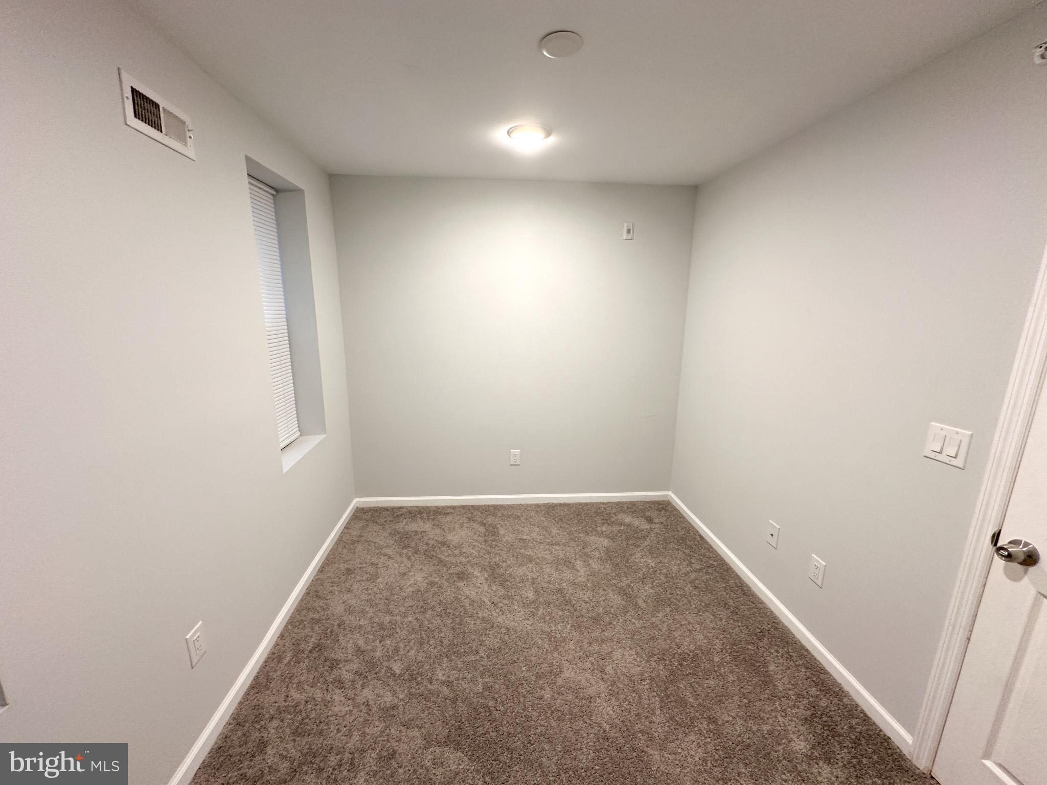 2404 West Thompson Street, Unit A Philadelphia, PA 19121 - Photo 11 of 13 an empty room with window