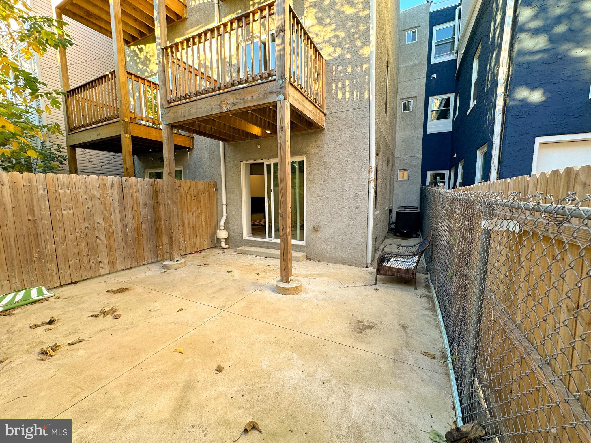 2404 West Thompson Street, Unit A Philadelphia, PA 19121 - Photo 13 of 13 a view of a house with a wooden fence