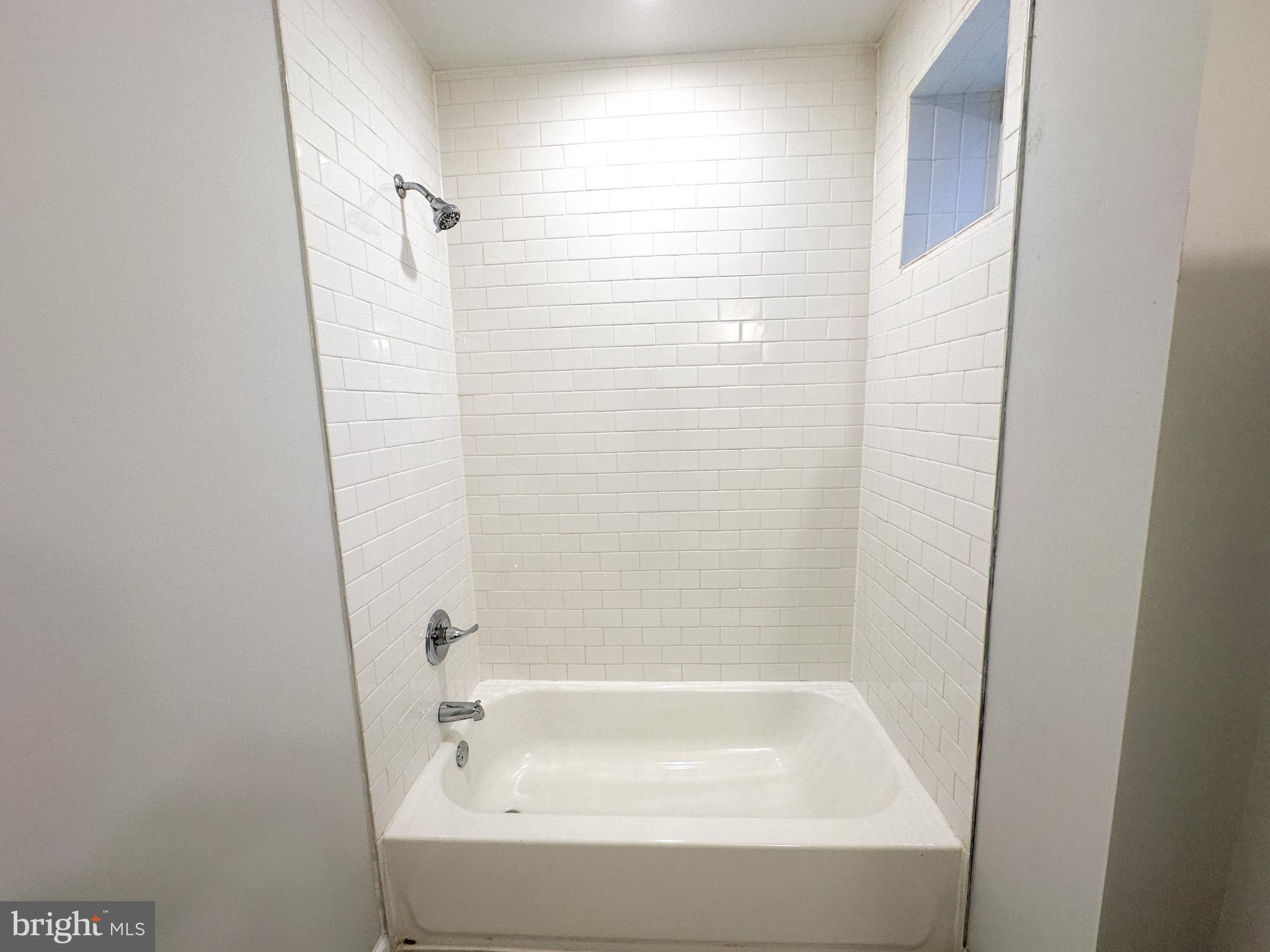 2404 West Thompson Street, Unit A Philadelphia, PA 19121 - Photo 5 of 13 a bathroom with a bathtub