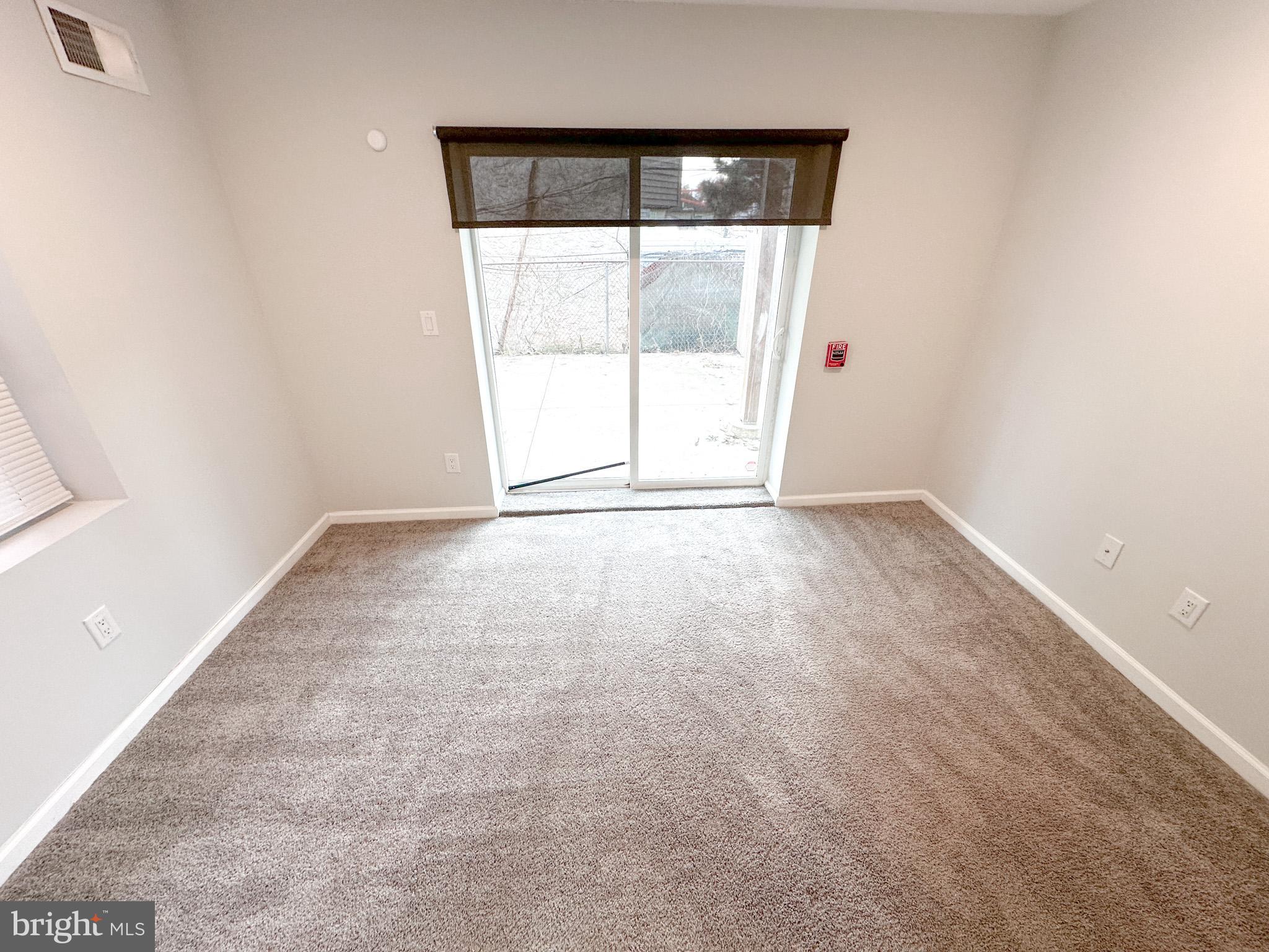 2404 West Thompson Street, Unit A Philadelphia, PA 19121 - Photo 8 of 13 an empty room with large window