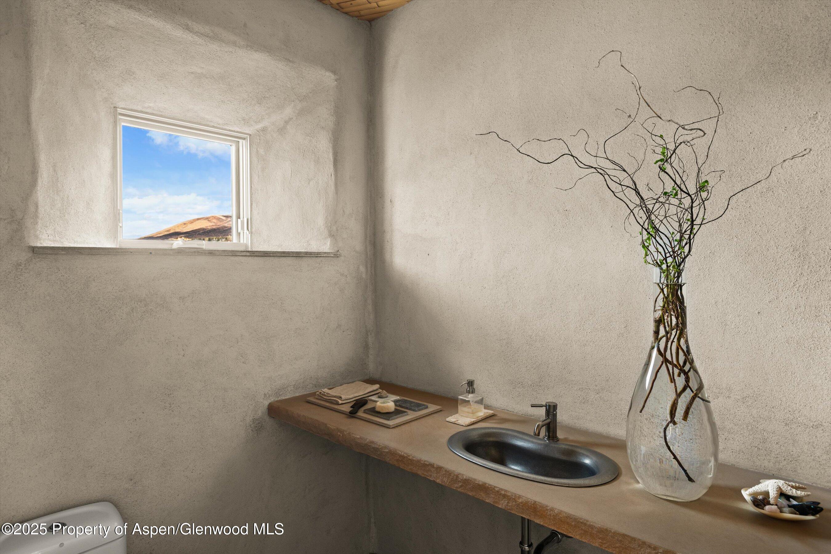 515 Park Circle Aspen, CO 81611 - Photo 11 of 34 a bathroom with a sink and a mirror