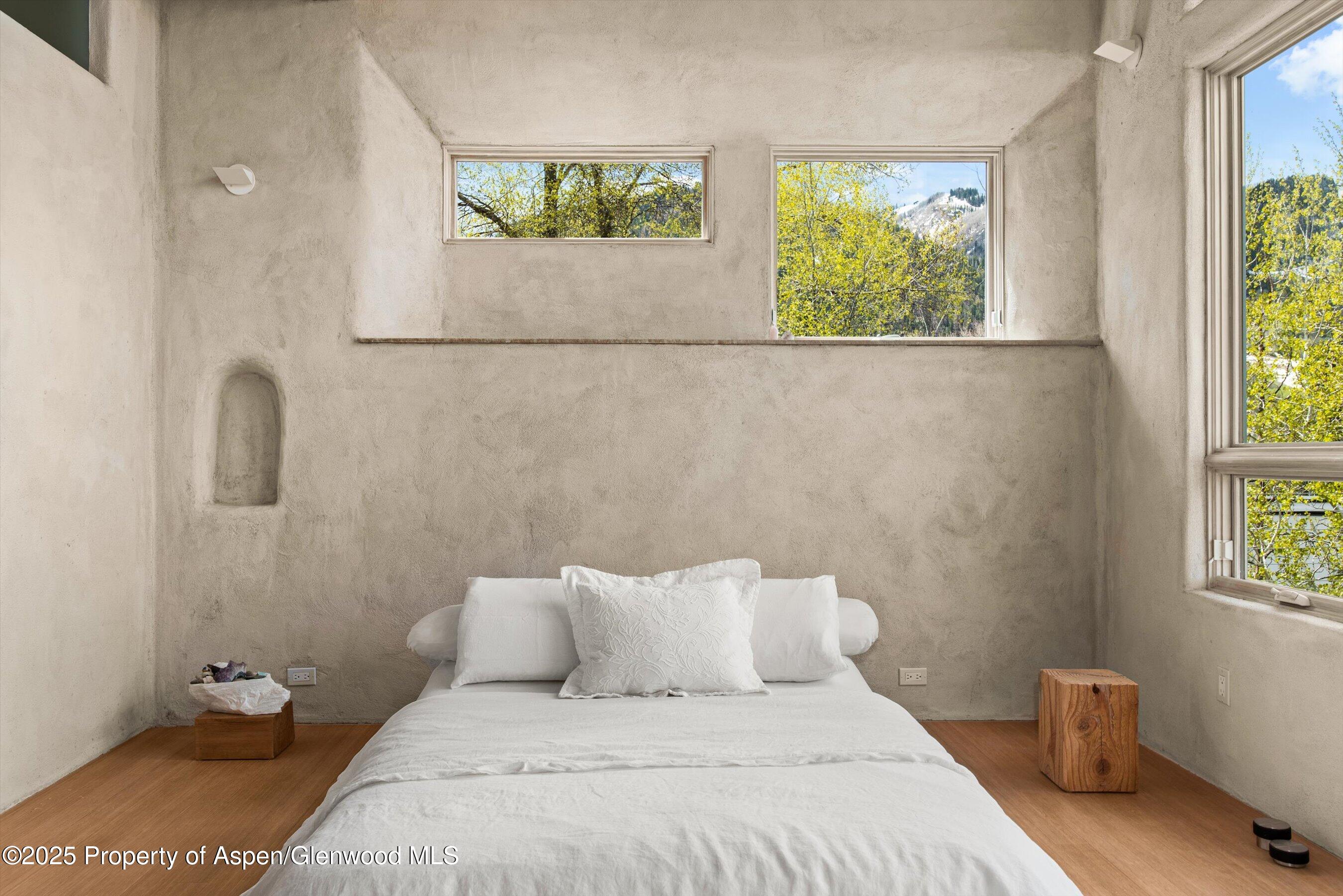 515 Park Circle Aspen, CO 81611 - Photo 12 of 34 a bedroom with a bed and a window