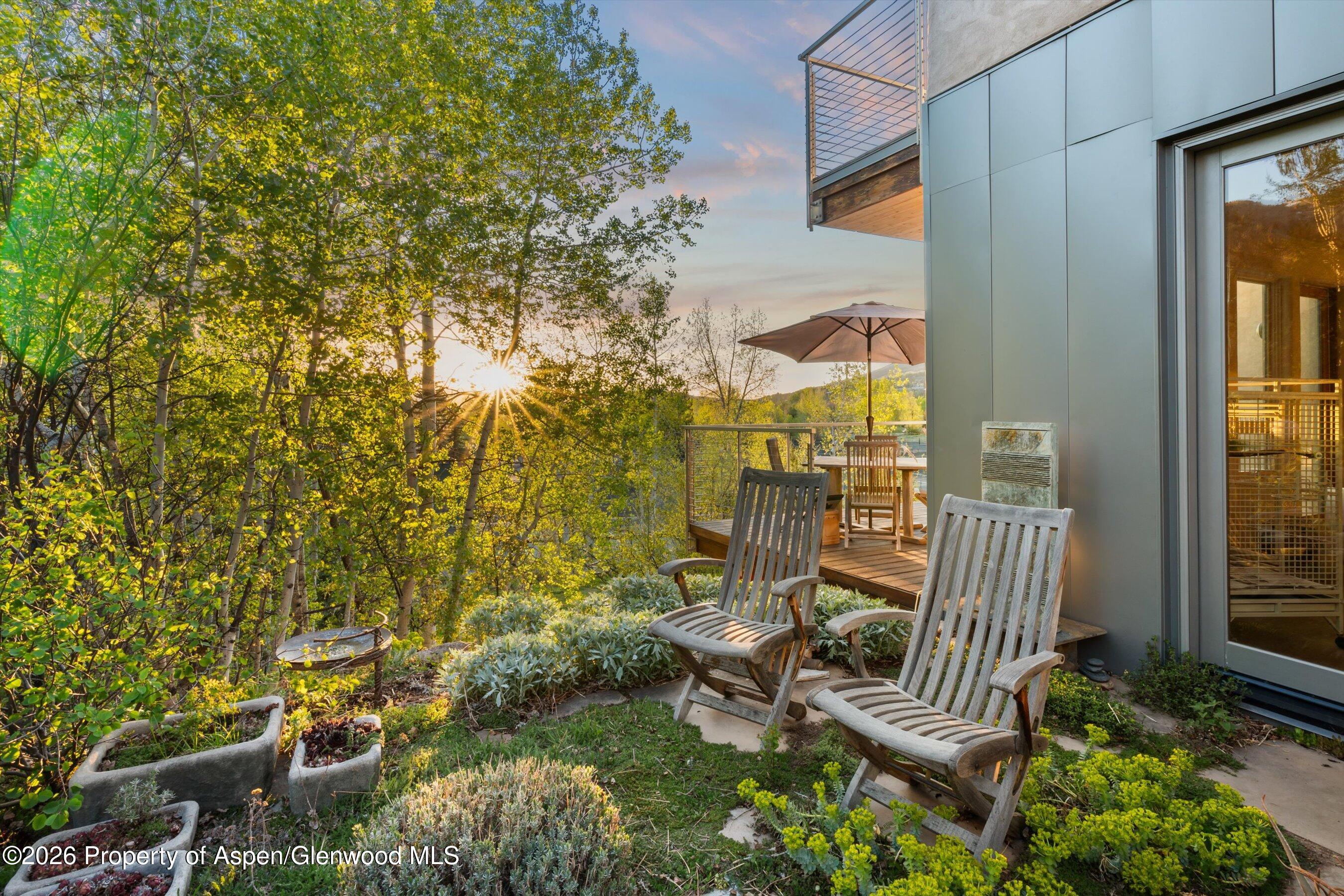 515 Park Circle Aspen, CO 81611 - Photo 26 of 34 a view of a house with a yard and sitting area