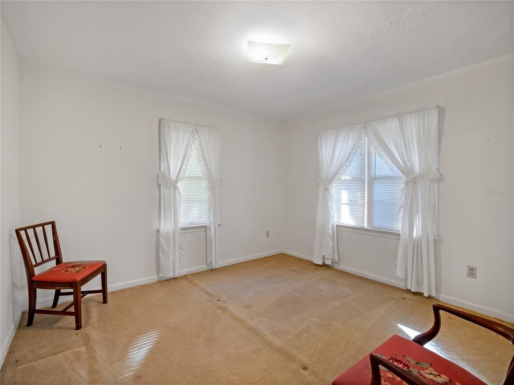 1631 Southeast 17th Street Ocala, FL 34471 - Photo 17 of 36 an empty room with a window