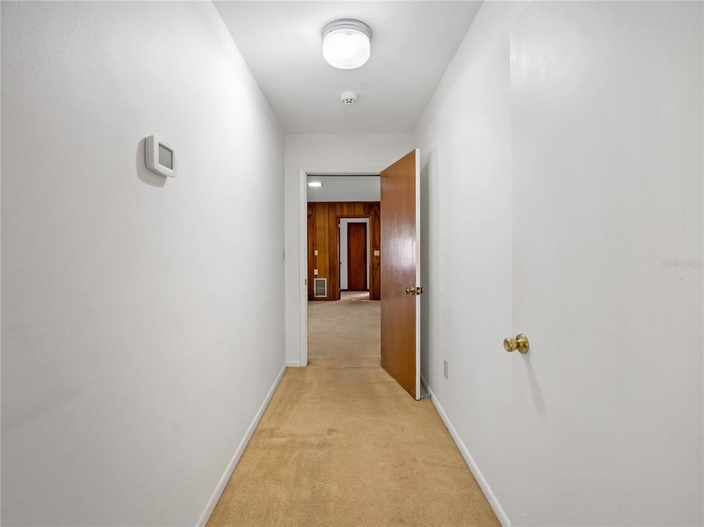 1631 Southeast 17th Street Ocala, FL 34471 - Photo 22 of 36 a view of a hallway with closet