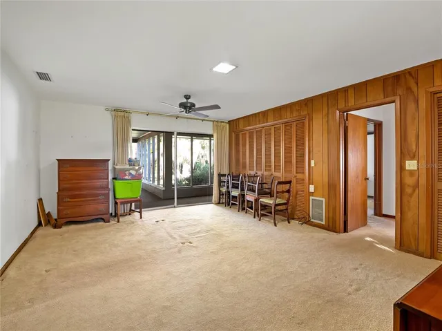 an empty room with furniture and a window