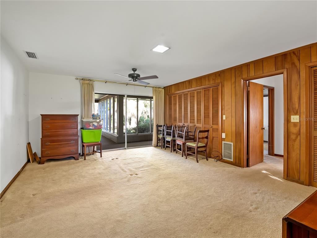 1631 Southeast 17th Street Ocala, FL 34471 - Photo 23 of 36 an empty room with furniture and a window