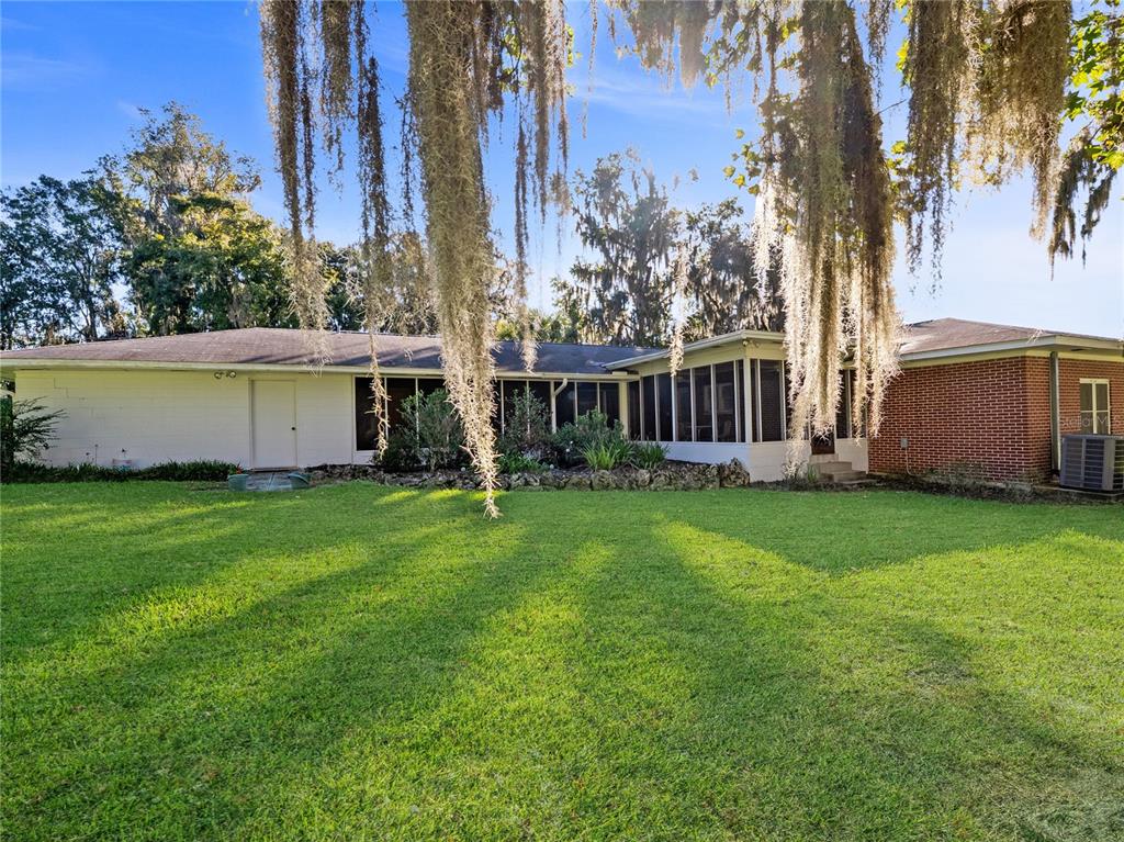1631 Southeast 17th Street Ocala, FL 34471 - Photo 32 of 36 a view of a house with backyard and garden