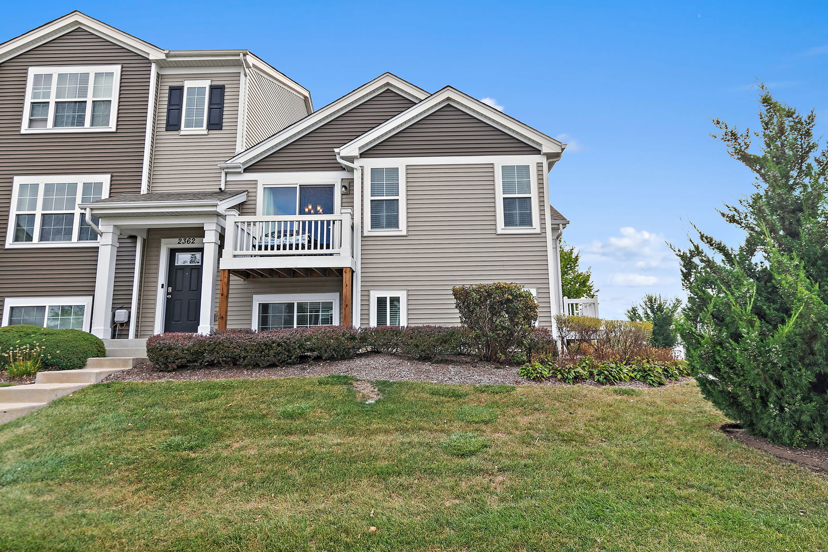 2360 Upland Road, Unit 2267 Hampshire, IL 60140 - Photo 14 of 26 a front view of a house with garden
