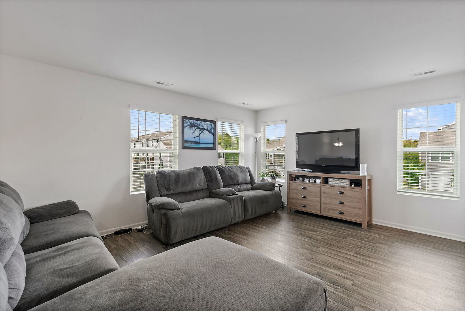 2360 Upland Road, Unit 2267 Hampshire, IL 60140 - Photo 3 of 26 a living room with furniture and a flat screen tv