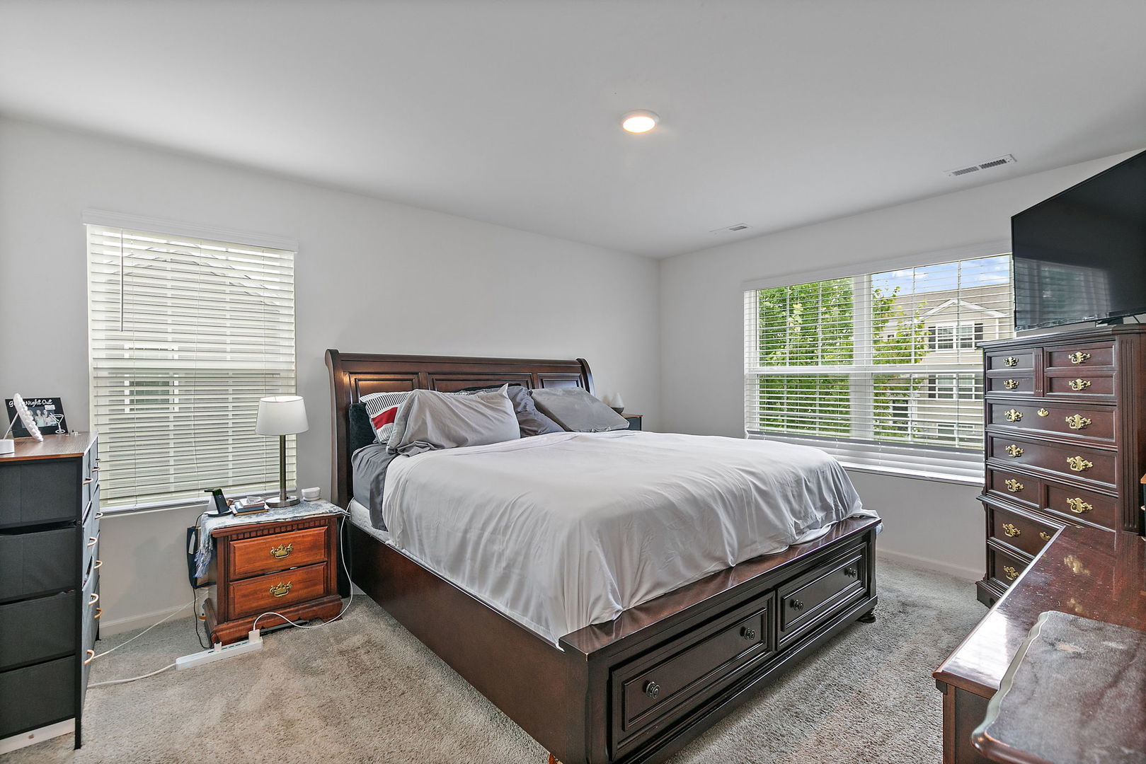 2360 Upland Road, Unit 2267 Hampshire, IL 60140 - Photo 7 of 26 a bed sitting in a bedroom next to a window