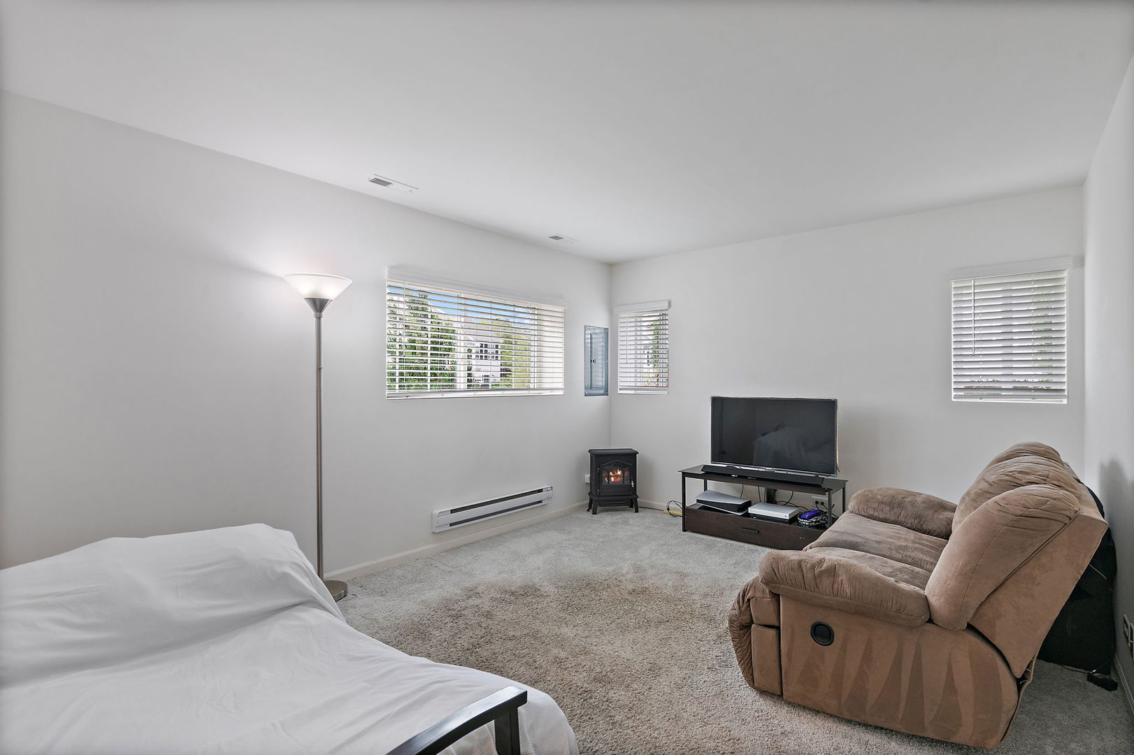 2360 Upland Road, Unit 2267 Hampshire, IL 60140 - Photo 10 of 26 a living room with furniture and a flat screen tv
