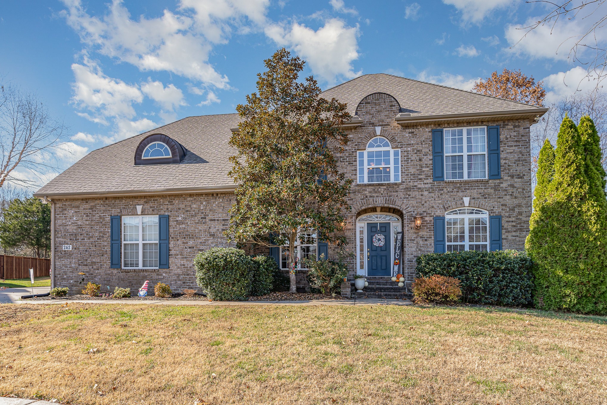 a front view of a house with a yard