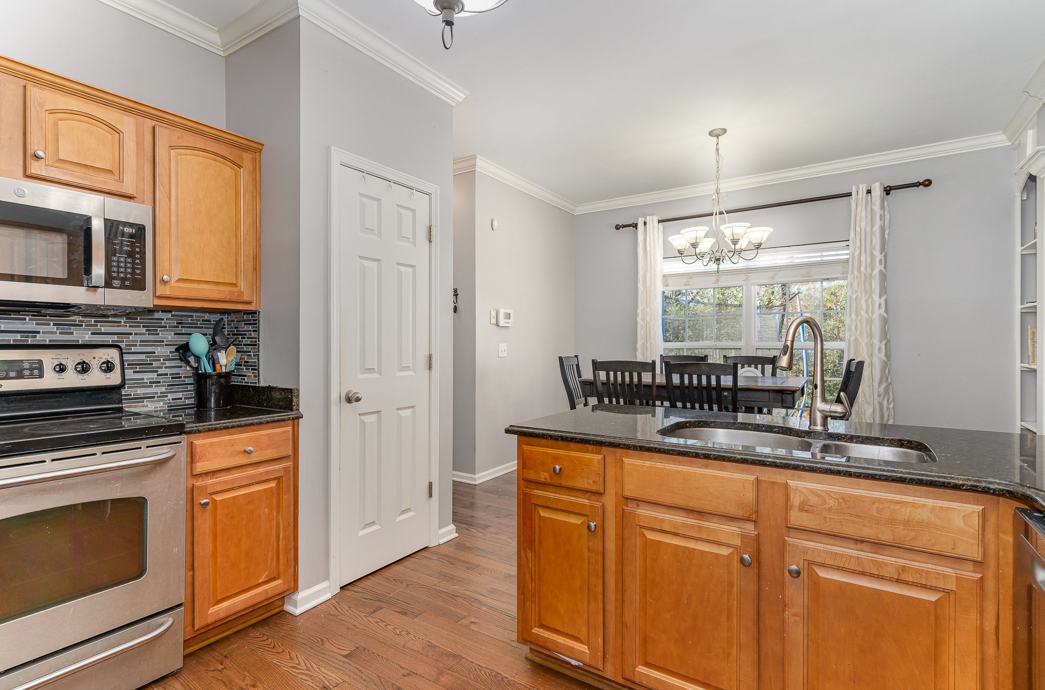 242 Foundry Circle Murfreesboro, TN 37128 - Photo 11 of 26 a kitchen with stainless steel appliances granite countertop a stove a sink and a refrigerator
