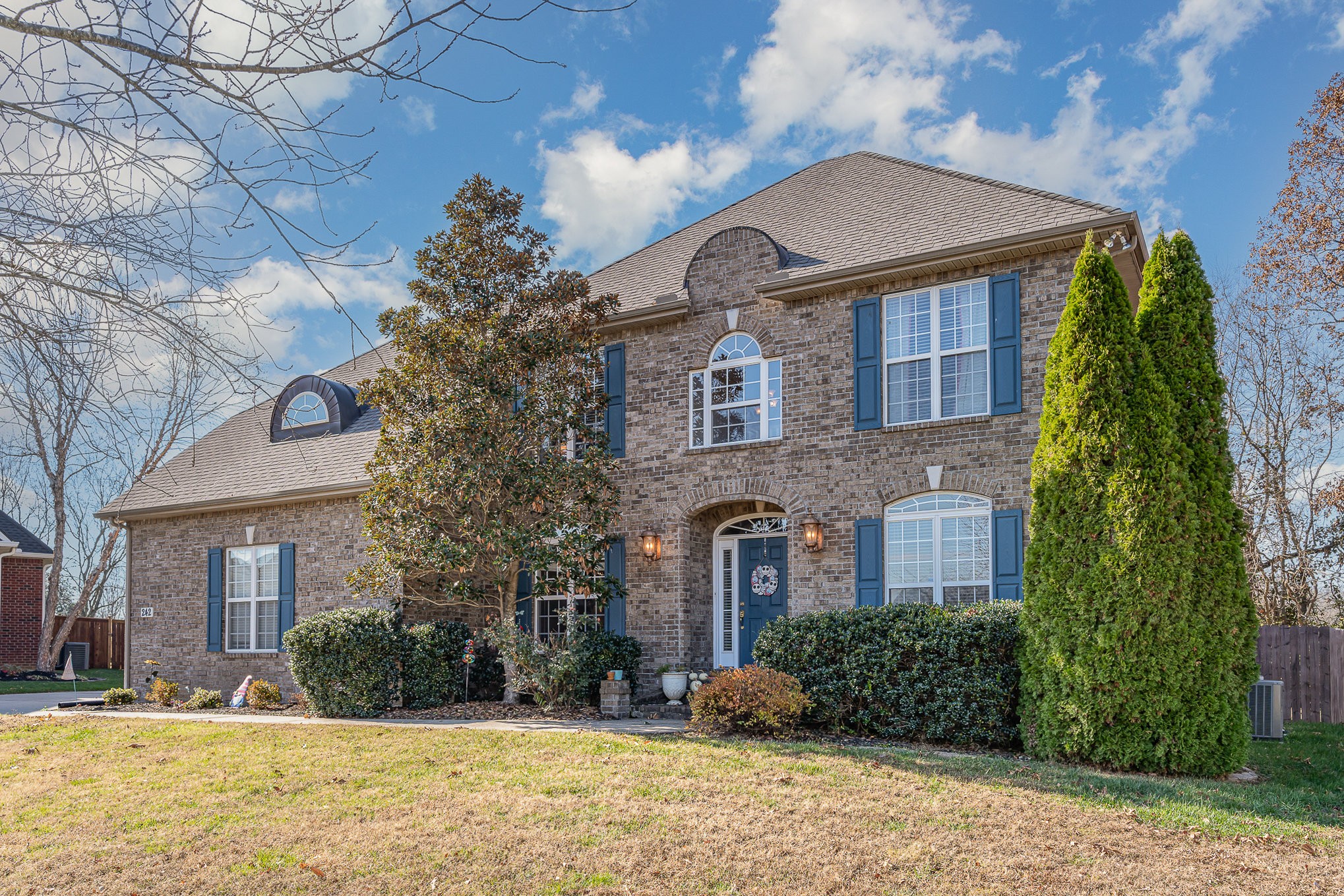 242 Foundry Circle Murfreesboro, TN 37128 - Photo 4 of 26 a front view of a house with a yard