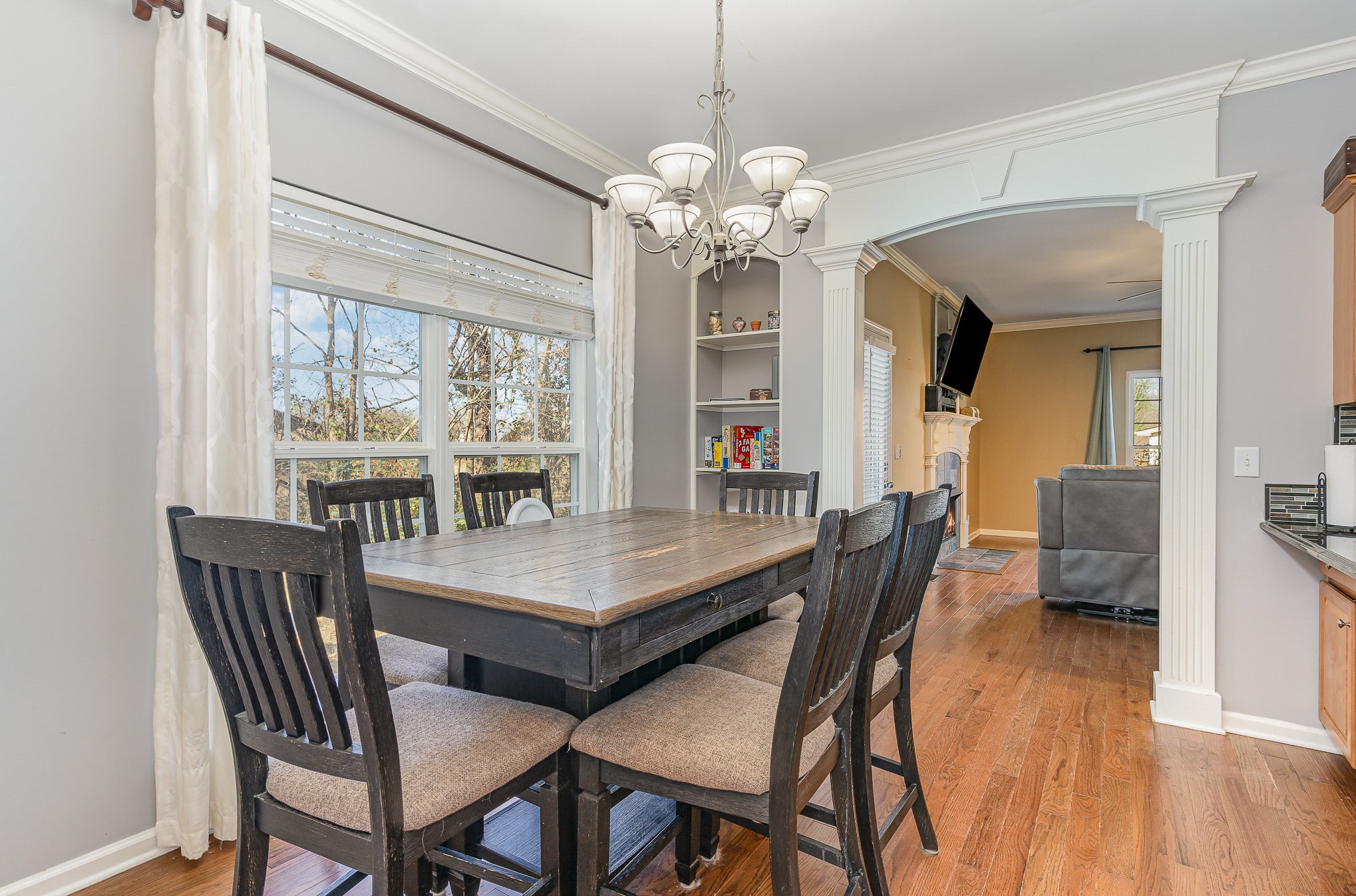 242 Foundry Circle Murfreesboro, TN 37128 - Photo 9 of 26 a view of a dining room with furniture wooden floor and chandelier