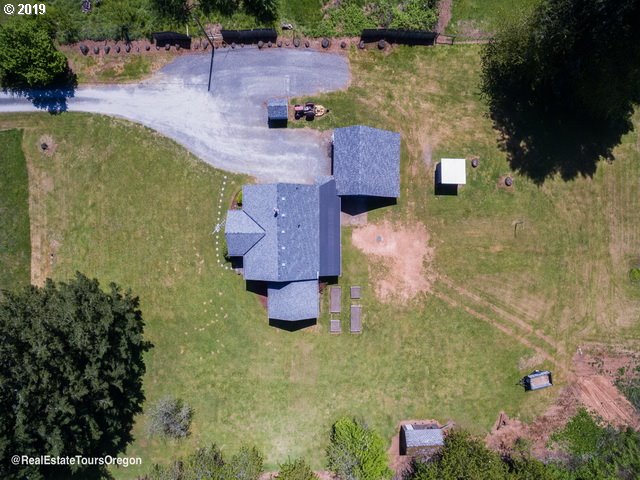24311 South Larkin Road Beavercreek, OR 97004 - Photo 25 of 31 an aerial view of a house with a yard
