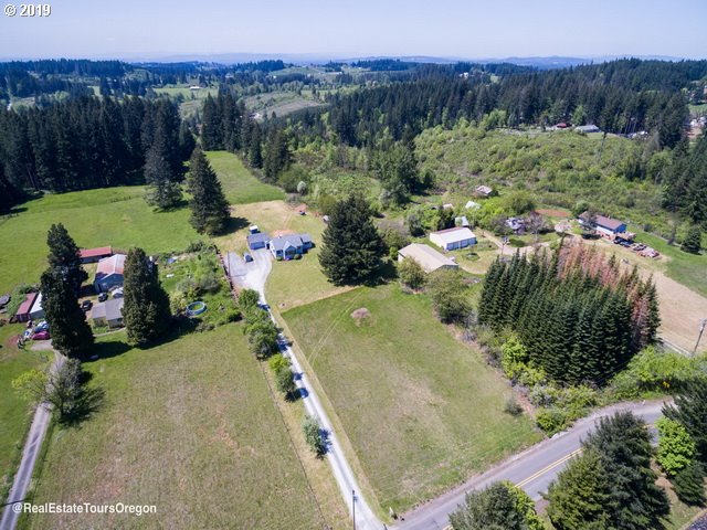 24311 South Larkin Road Beavercreek, OR 97004 - Photo 28 of 31 an aerial view of a house with mountain view