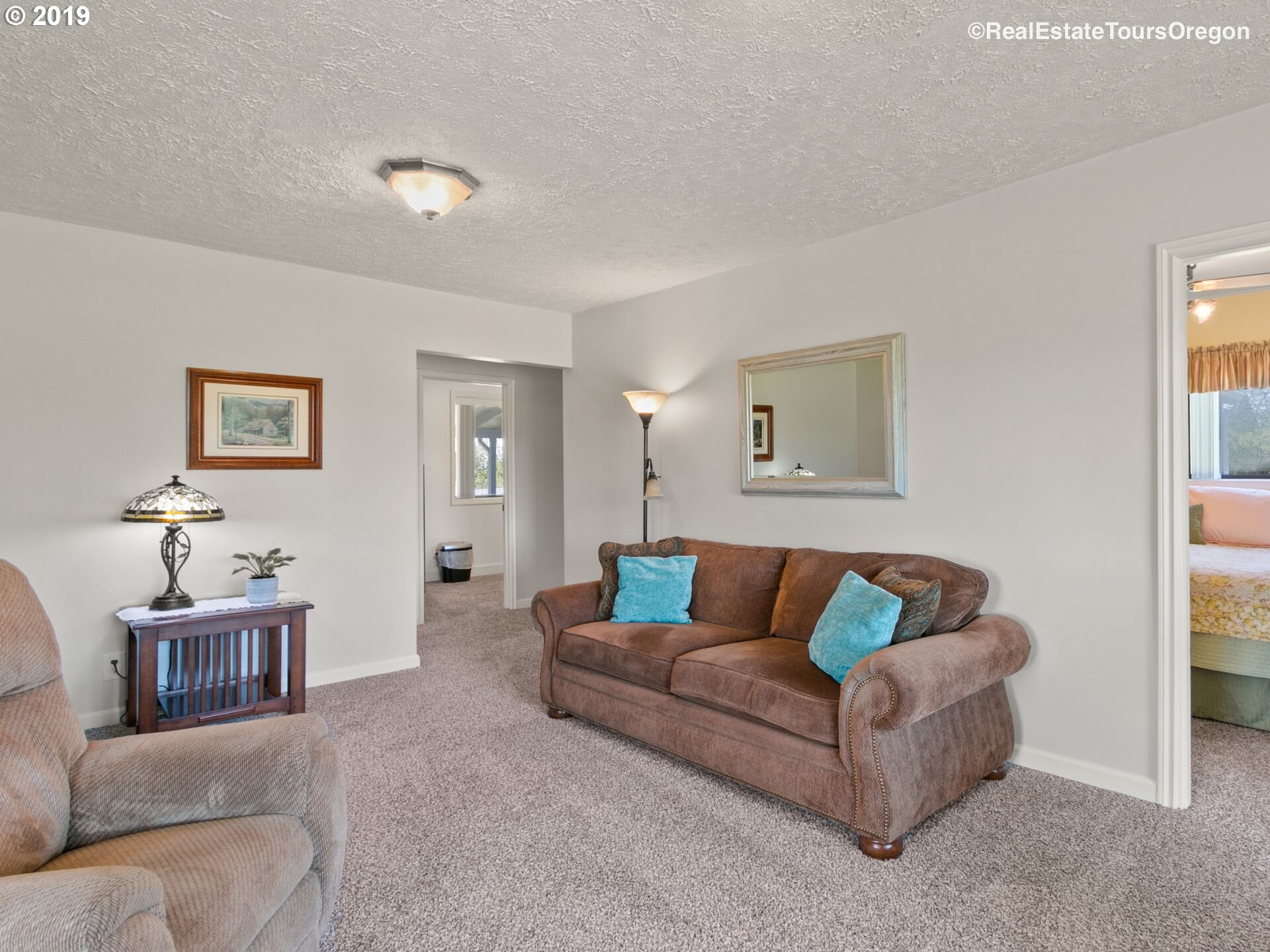 24311 South Larkin Road Beavercreek, OR 97004 - Photo 3 of 31 a living room with furniture and a couch