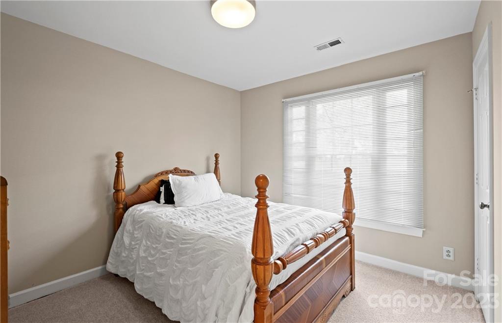 13514 O O'Malley Drive Matthews, NC 28105 - Photo 14 of 20 a bedroom with bed and a window