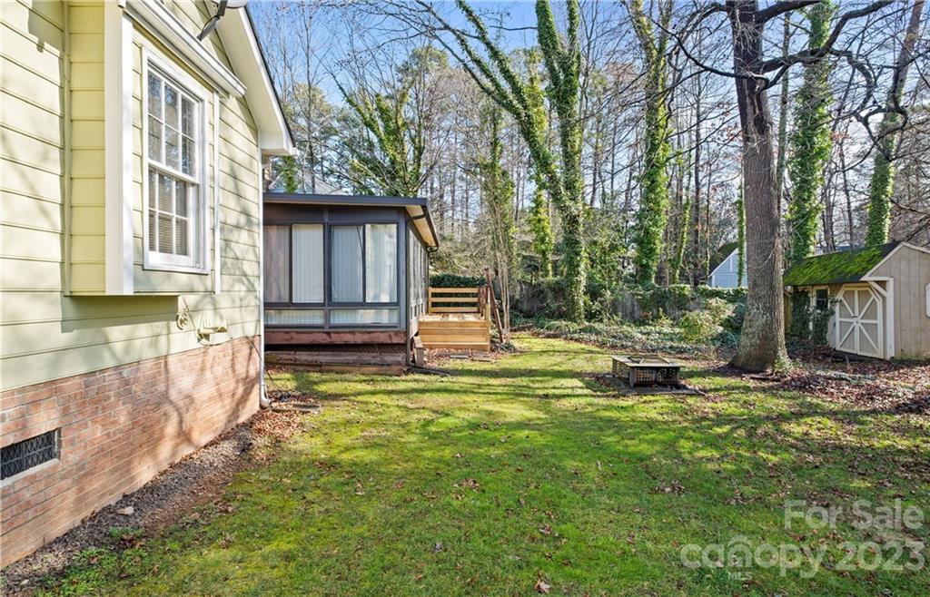 13514 O O'Malley Drive Matthews, NC 28105 - Photo 18 of 20 a view of a house with a yard fire pit and a large tree