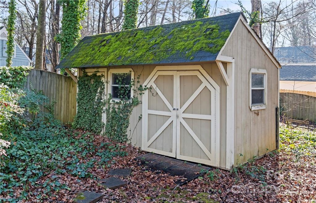 13514 O O'Malley Drive Matthews, NC 28105 - Photo 20 of 20 a view of small house with garden