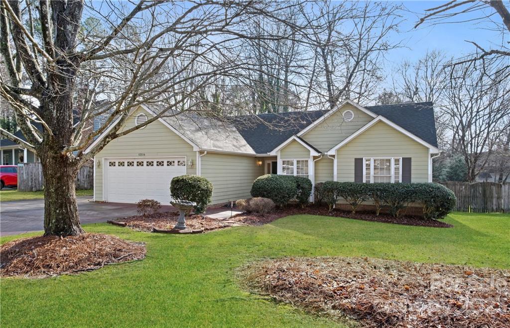 13514 O O'Malley Drive Matthews, NC 28105 - Photo 2 of 20 a front view of a house with garden