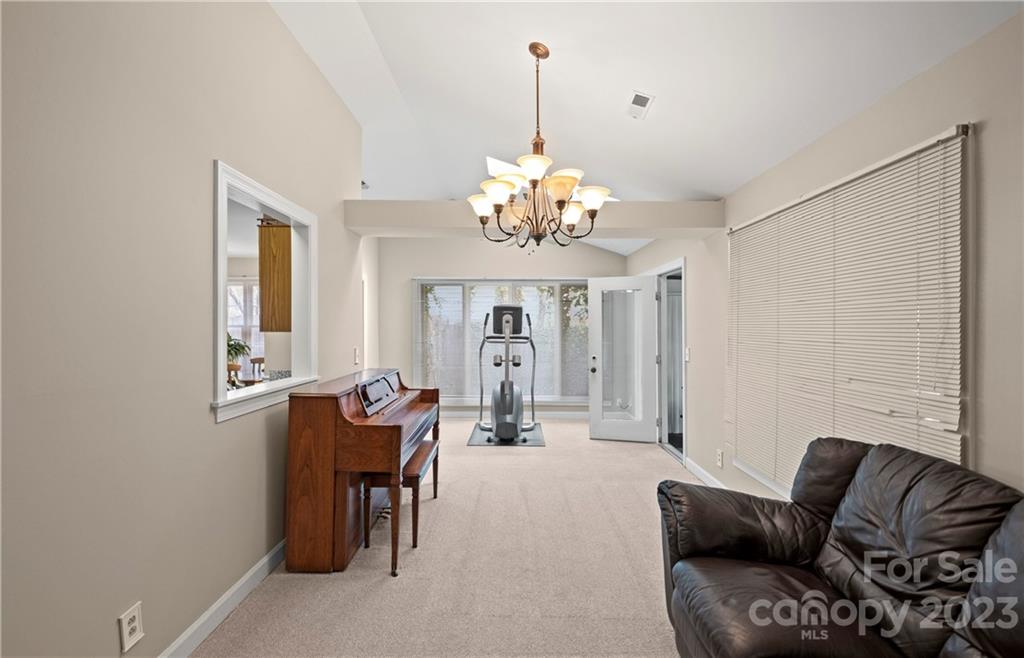 13514 O O'Malley Drive Matthews, NC 28105 - Photo 6 of 20 a living room with furniture and a chandelier