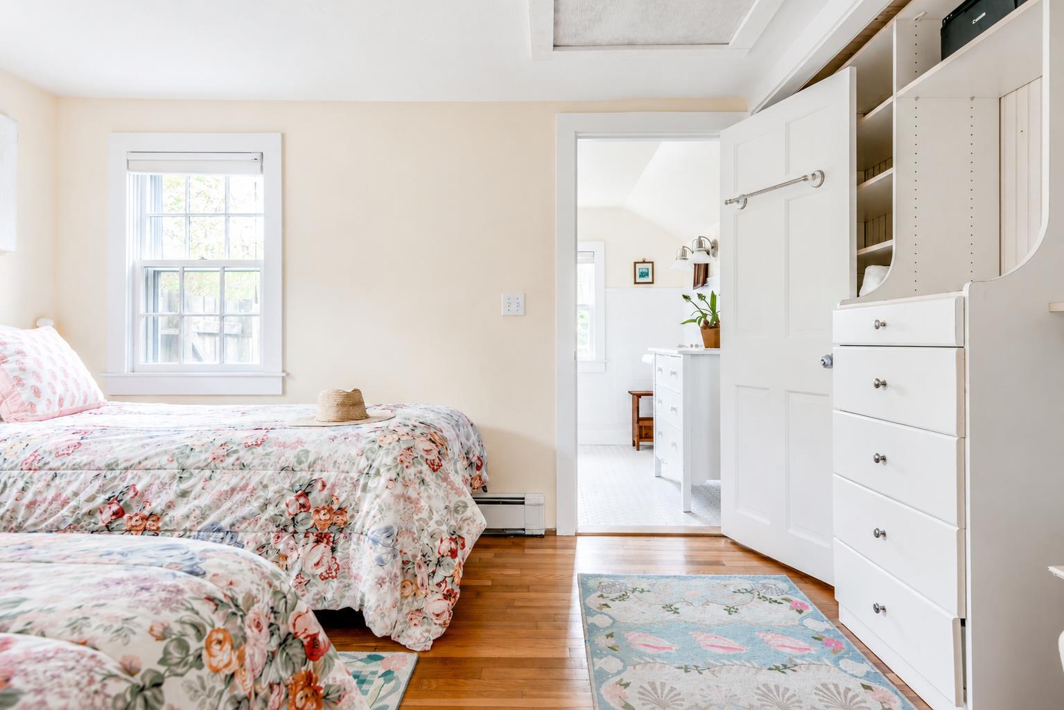 12 King Street Nantucket, MA 02554 - Photo 15 of 32 a bedroom with a bed and a dresser
