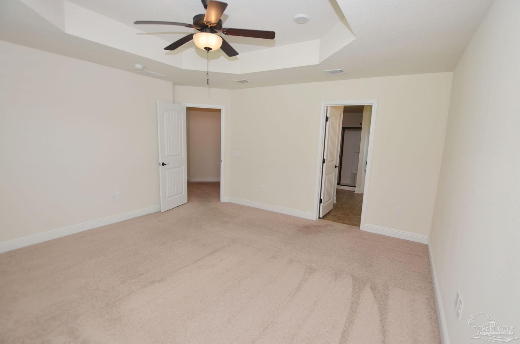 5709 Mill Stream Way Pace, FL 32571 - Photo 23 of 48 a view of an empty room and a ceiling fan