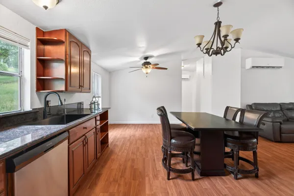 a bathroom with a sink mirror vanity and toilet