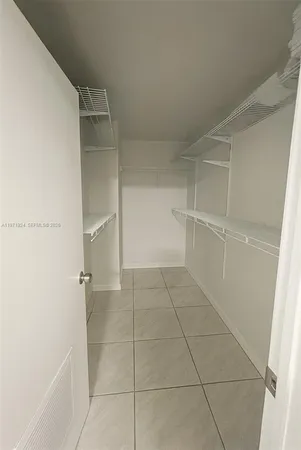 a view of an empty walk in closet