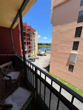 a view of a balcony with chairs