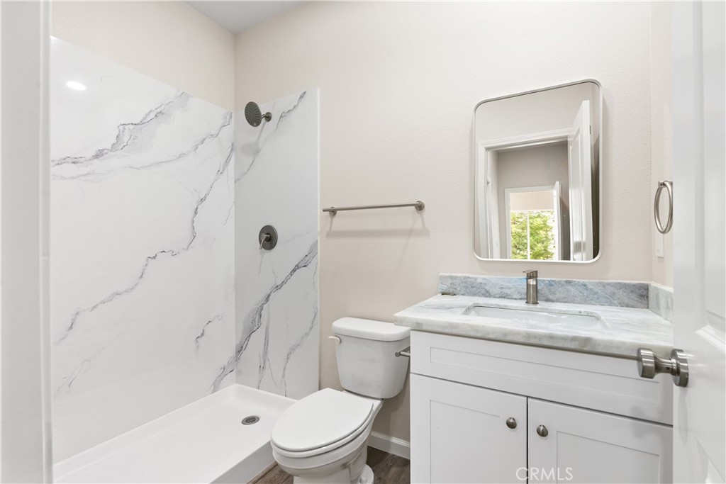 5583 Linrich Lane Paradise, CA 95969 - Photo 27 of 33 a bathroom with a sink a toilet and shower